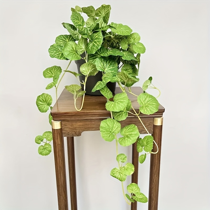 An artificial hanging vine pla - Pilea Peperomioides recension och pris