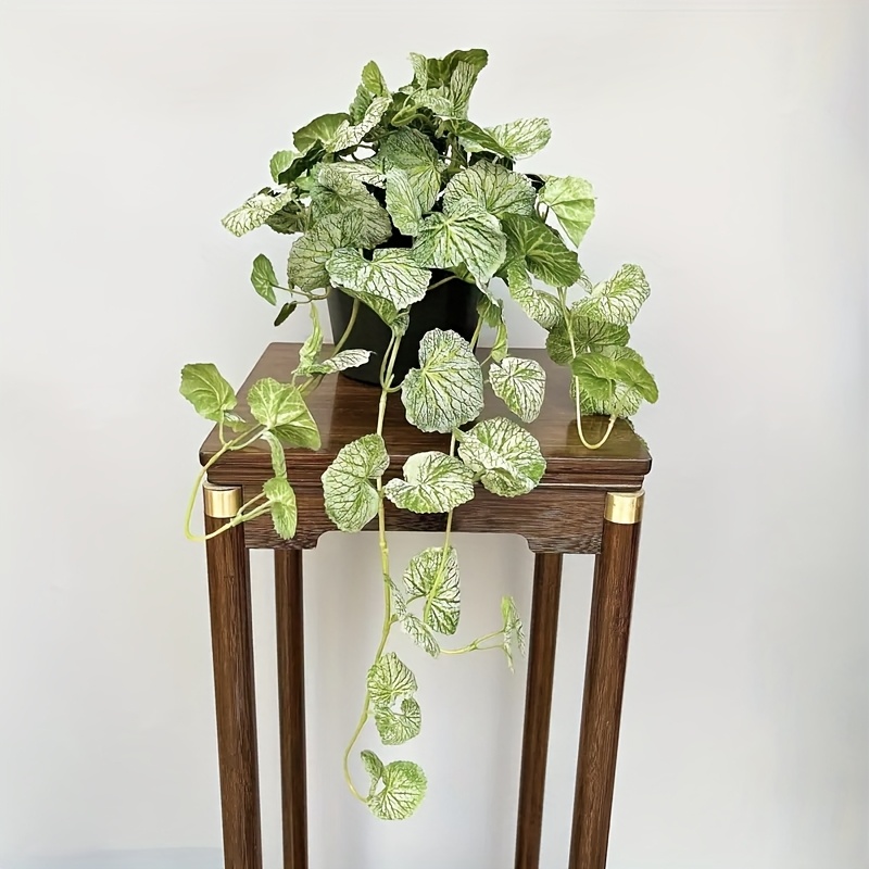 An artificial hanging vine pla - Pilea Peperomioides recension och pris